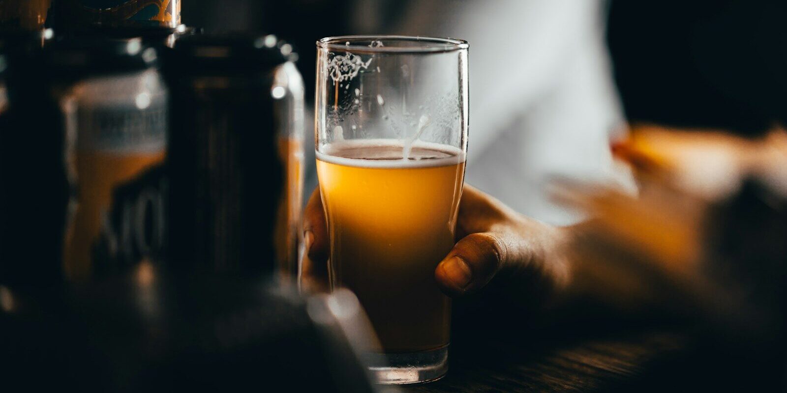 clear drinking glass with yellow liquid